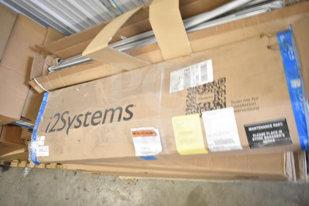 Cardboard box labeled i2Systems, containing 20 various items including light strips. Visible tags and barcodes indicate contents and instructions.
