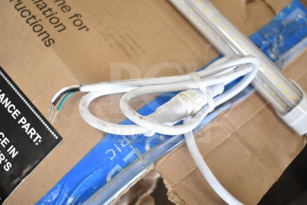 Bundle of various electronic items including i2Systems light strips and wiring, as depicted on cardboard packaging. Condition appears used.