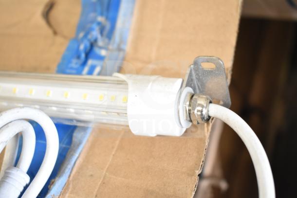 LED light strip by i2Systems, featuring a white connector and mounting bracket. Condition appears good, minimal wear.