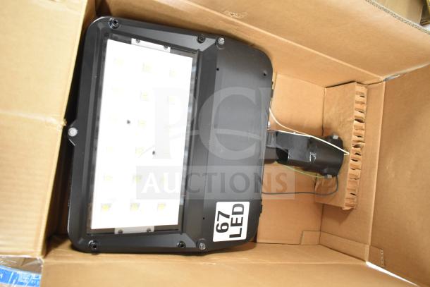 GE K5SM flood light in box, labeled "67 LED," part of 16-item auction lot.