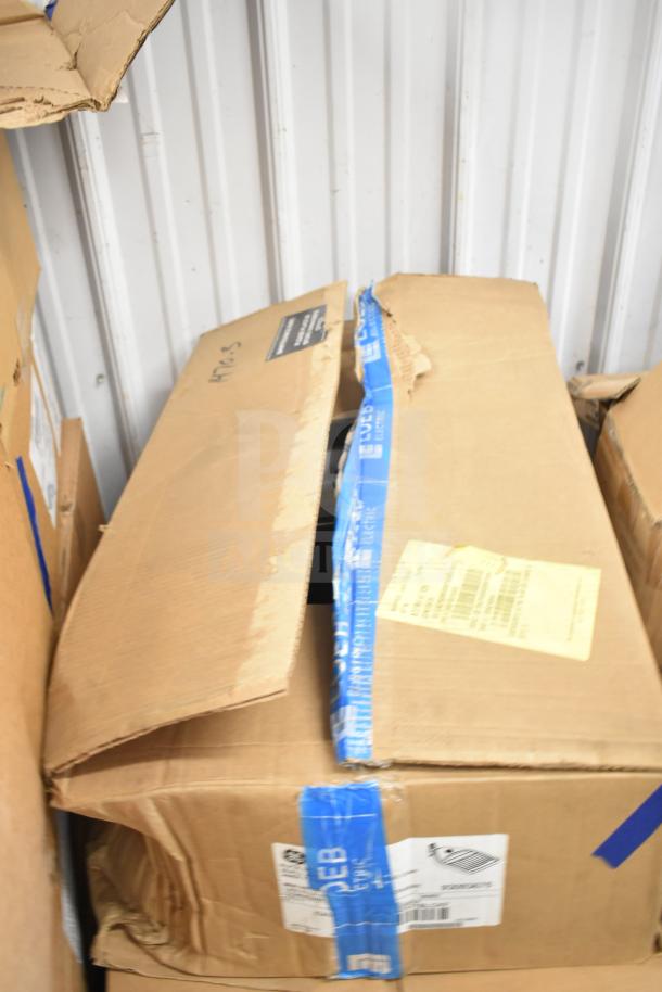 Box with 16 various items including GE K5SM flood light, visible warehousing labels and blue tape on packaging.