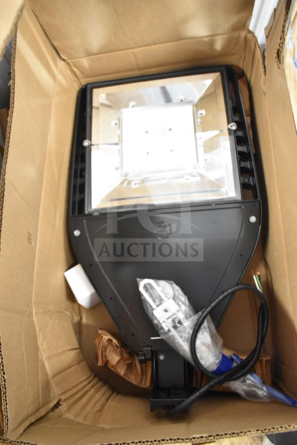 GE K5SM flood light, new in box with mounting accessories. Part of a 16-item auction lot.