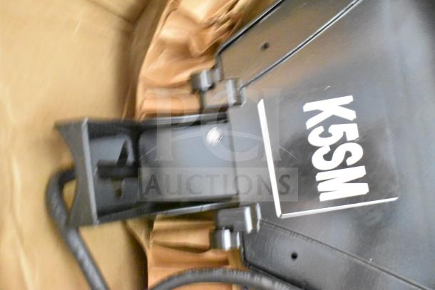 GE K5SM flood light in black, showing label and socket details, part of a 16-item auction lot.