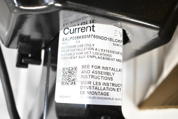 GE K5SM flood light with label showing model EALP035K5SM750NDD1BLCKF, 480V, suitable for wet locations, outdoor use.