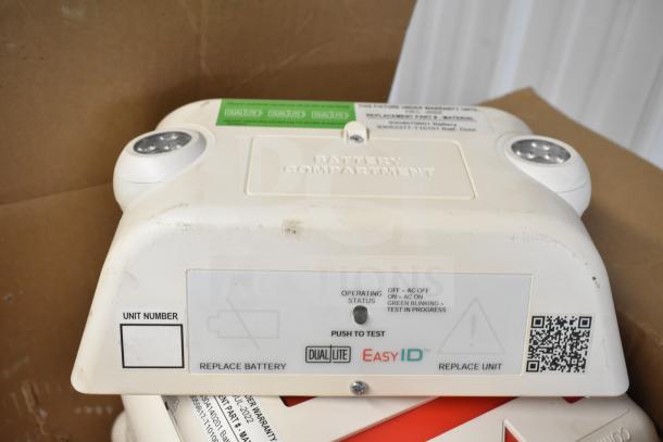 DualLite EVODW Double Remote Head, brand new, with battery compartment and EasyID feature. Labels include operating status.