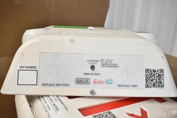 DualLite EVODW Double Remote Head with EasyID label, push-to-test button, and replace battery indicator. Brand new condition.