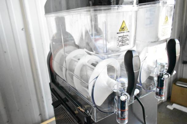 Brand new Galaxy 177GSM2 double 3-gallon pourover granita machine, 120V, slight scratch and dent, clear tanks, black handles.