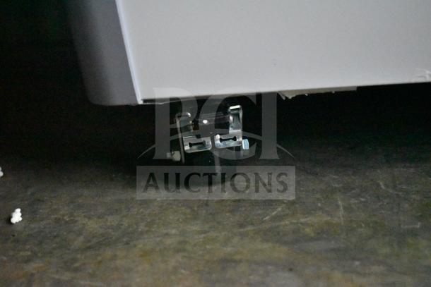 Brand new Avantco 360DFC6HCL ice cream freezer caster detail. Some visible scratches; customizable curved top design.