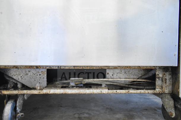 Vulcan 36S-Y1A commercial gas range base, showing casters, cables, and undercarriage in used condition.