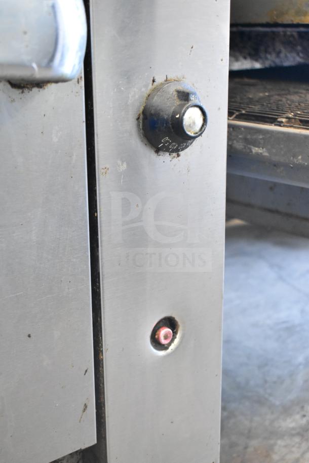 Close-up of a Vulcan 36S-Y1A commercial range showing control knob and panel. Slight wear visible on stainless steel surface.