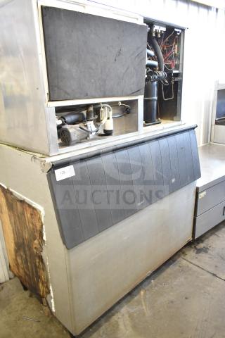 Hoshizaki KM-1301SWH commercial ice head on bin, 208-230 volts, 1 phase, visible wear on the exterior, tag number 128.