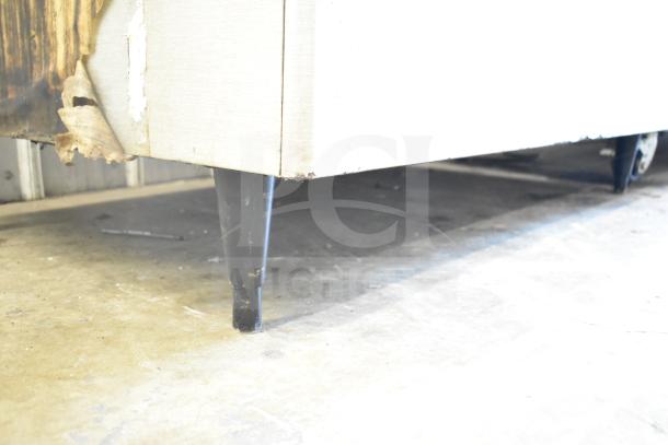 Hoshizaki KM-1301SWH ice machine unit on bin, weathered exterior, 208-230V, 1 phase, suitable for commercial use.