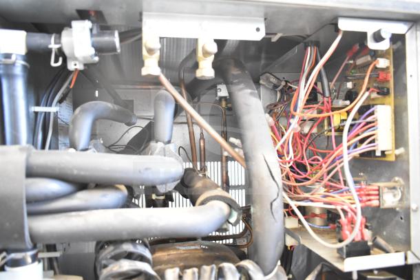 Hoshizaki KM-1301SWH Commercial Ice Head with wiring and components visible. Power: 208-230V, 1 Phase.