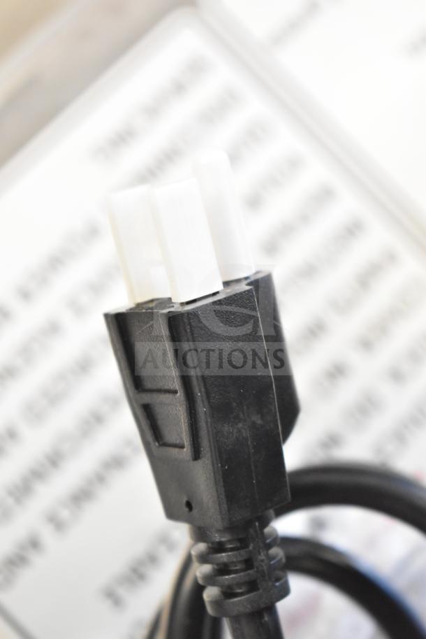 Close-up of the power cord plug for the Fryclone 259OFM55 low-profile fryer oil filter machine.