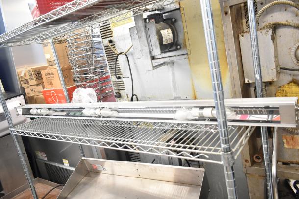Vollrath Cayenne Light Strip on wire rack, new condition, includes labels, ideal for food warming, stainless steel finish.