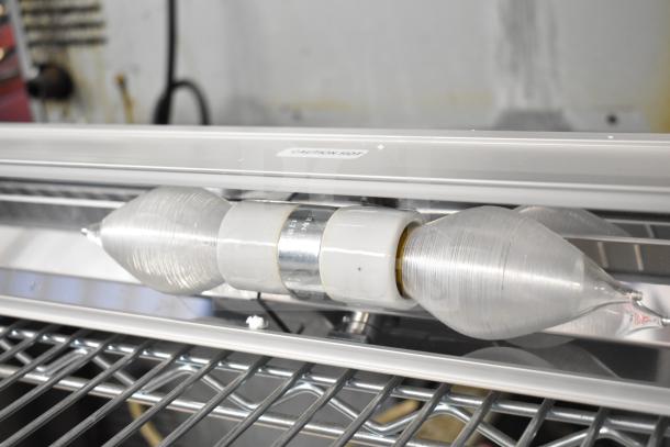 Vollrath Cayenne Light Strip showing tubular silver bulb, caution hot label. Excellent condition, metal frame, ideal for warming.