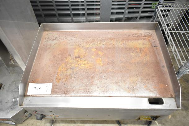 Countertop electric flat top griddle, 208V, 1 phase, used condition with rust spots, auction tag numbered 137.