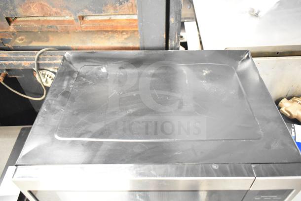 2019 GE JES1657SM1SS Countertop Microwave, stainless steel, 120V, 1 phase. Scratches visible on the top surface.