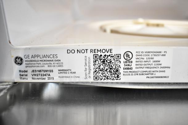 2019 GE JES1657SM1SS countertop microwave, 120 Volts, 1 Phase, label showing model, serial number, and specs.