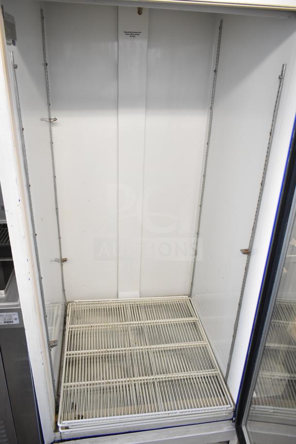 Beverage Air MT27 Commercial Single Door Cooler, white interior, removable shelves, 115V, model tag visible inside.