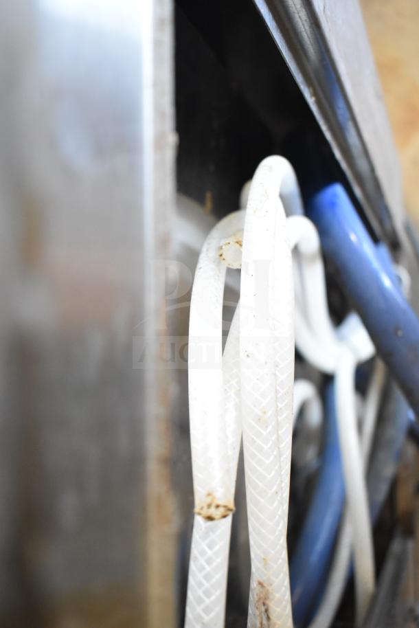 Close-up of hoses on a commercial 6-flavor carbonated beverage machine and Servend DI-1522 ice bin. 115 volts, 1 phase.