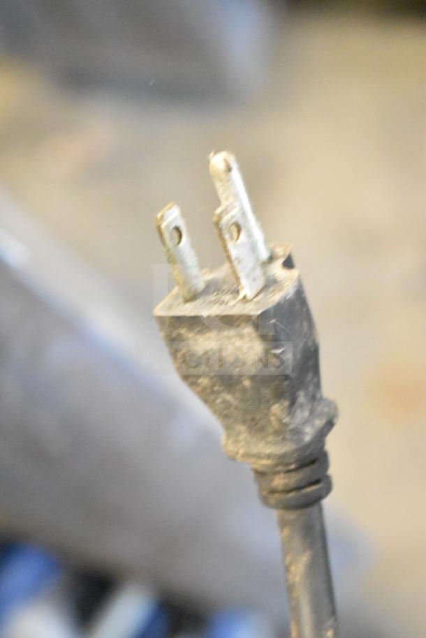 Close-up of a plug from a commercial beverage machine. Notable wear visible; connected to Servend DI-1522 ice bin.