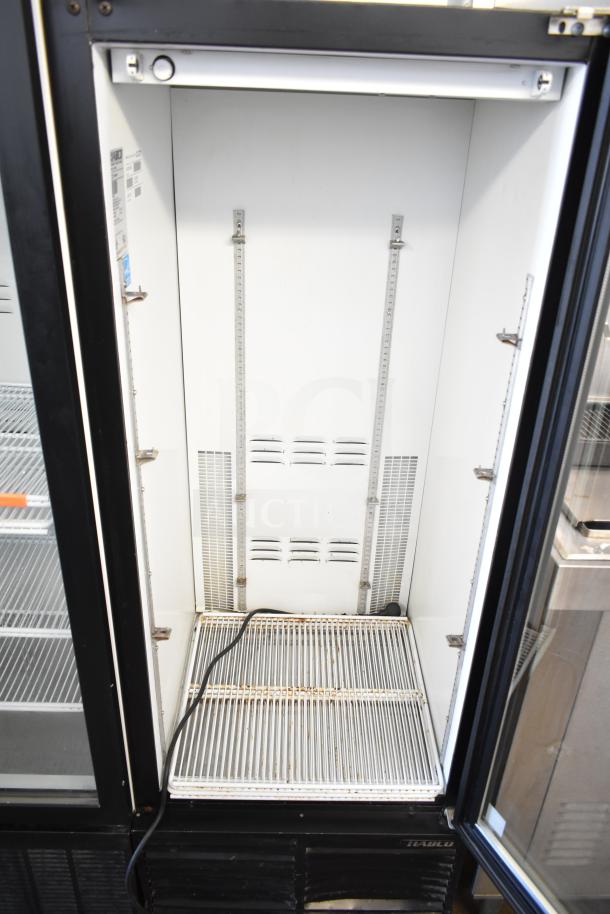 Habco ESM12 commercial single door reach-in cooler, 115 volts, 1 phase, interior view, metal shelving, fair condition.