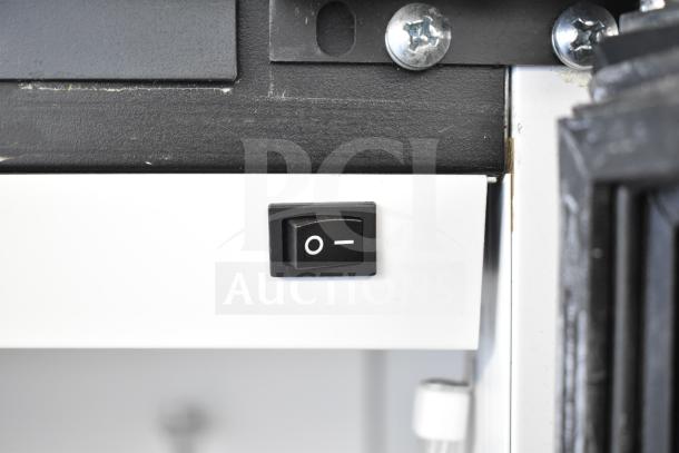 Power switch of a 2019 Habco SE18 Commercial Single Door Reach-In Cooler, 115 Volts, close-up view.