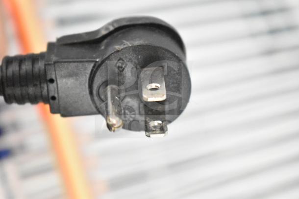 Close-up of a three-prong power plug for a 2019 Habco SE18 Commercial Single Door Reach In Cooler Merchandiser, 115 volts, 1 phase.
