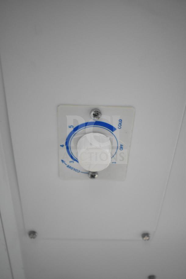 Thermostat dial for Beverage Air SR1HC-1S cooler, with settings from 0 (off) to 5 (cold), mounted on a white panel.