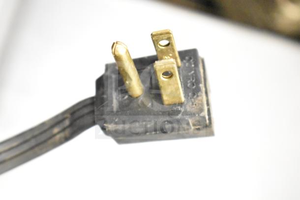 Close-up of a power plug for the Beverage Air SR1HC-1S cooler, showing three prongs for 120 volts, 1 phase connection.