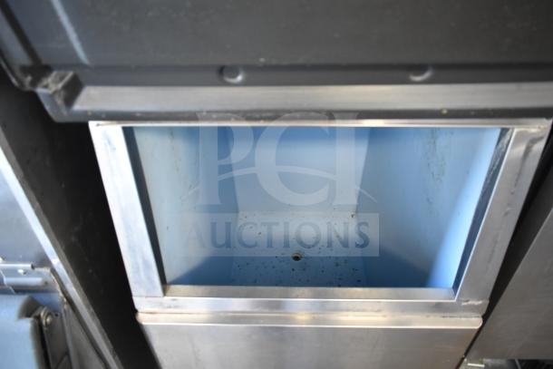 Hoshizaki KM-515MWH commercial ice maker, 115-120V, 1 phase, shown open inside a commercial ice bin, clean interior.