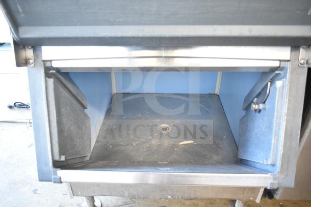 Atosa YR800-AP-261 commercial ice head on ice bin, 230 volts, showing interior storage compartment.