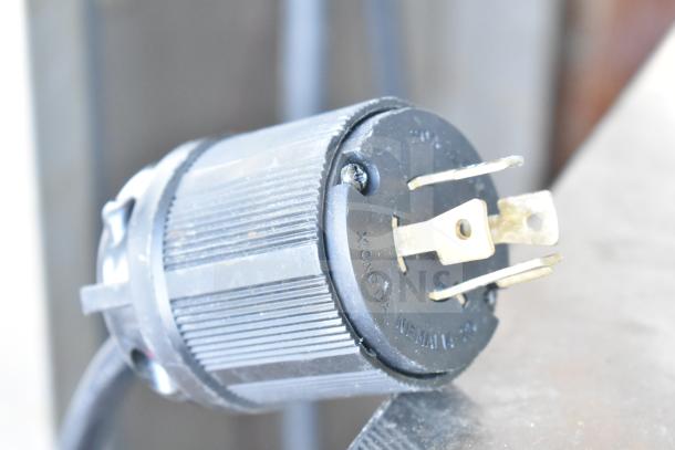 Power plug for Atosa YR800-AP-261 commercial ice machine, 230 volts, close-up of connector and prongs.