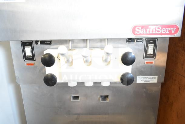 SaniServ W5273P soft serve ice cream machine, 2 flavors with twist, stainless steel, on commercial casters, 208-230V, 3-phase.