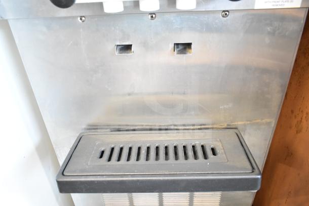 SaniServ W5273P commercial soft serve machine, dual flavor with twist, water-cooled, on casters, 208-230V, 3 phase.