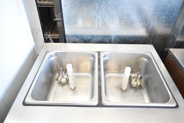 SaniServ W5273P soft serve machine with dual flavor twist option, water-cooled, stainless steel, commercial casters, 208-230V, 3 phase.