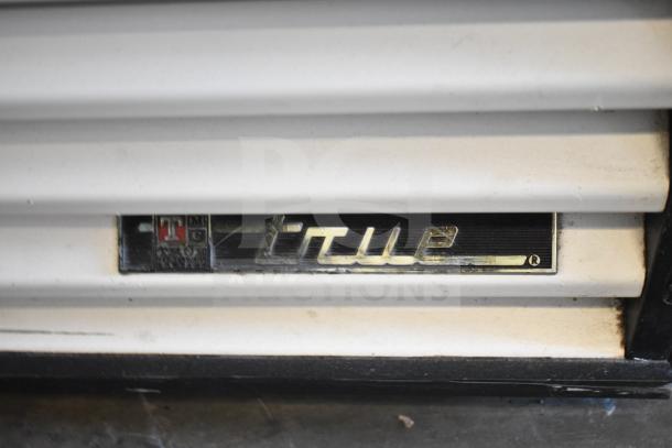 True GDM-49 Commercial 2 Door Reach In Cooler. Black "True" label on white panel. 115V, 1 Phase.