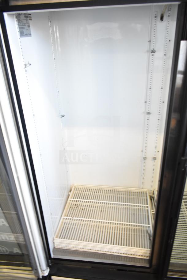 True GDM-49 Commercial 2 Door Reach In Cooler, white interior, visible shelves, 115 Volts, 1 Phase, good condition.