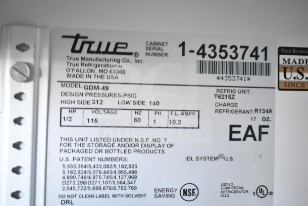 True GDM-49 cooler label showing model, 115V, 1 phase, and specifications for reach-in commercial use. Made in USA.