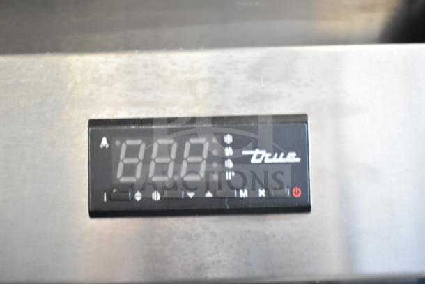 2019 True T-49G-HC cooler control panel close-up, showing digital display and True logo.