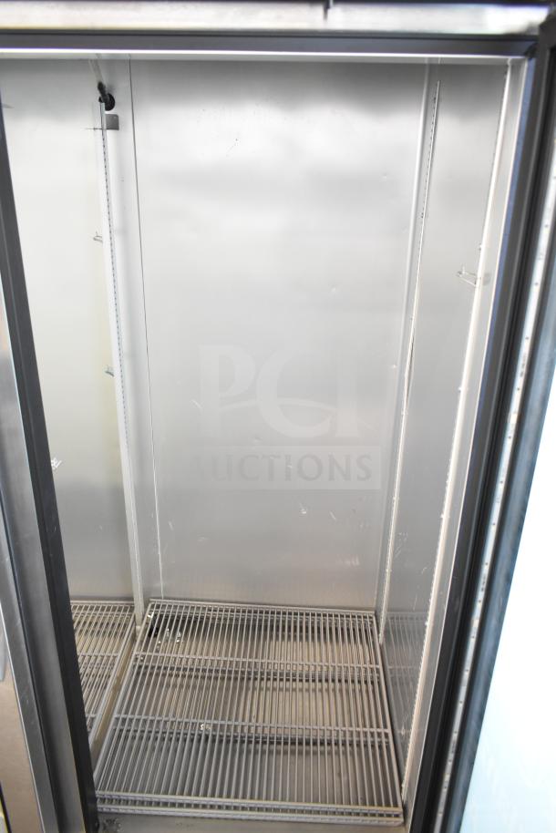 2019 True T-49G-HC Commercial 2 Door Reach-In Cooler, empty interior view, shelves visible. 115 Volts, 1 Phase.