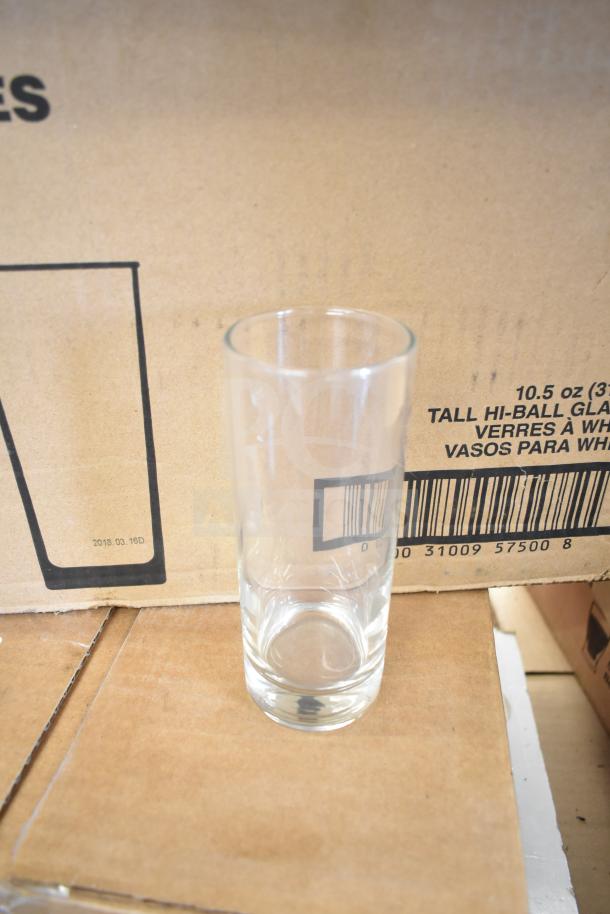 Libbey 2310 Lexington 10.5 oz. tall highball glass, clear, customizable, mint condition, shown against a cardboard box.