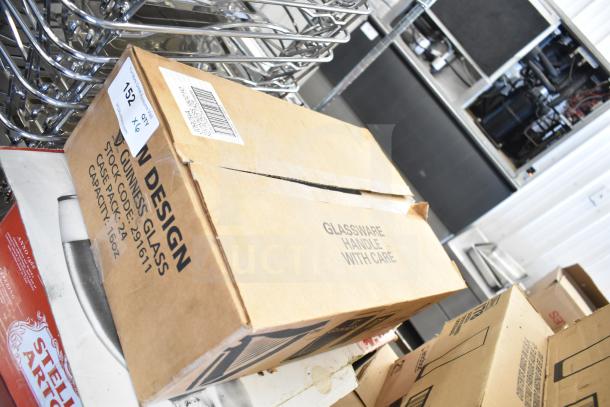 Boxes of Libbey and Guinness glasses, including 10.5 oz tall highball and 10 oz pilsner, marked “Glassware Handle With Care.”