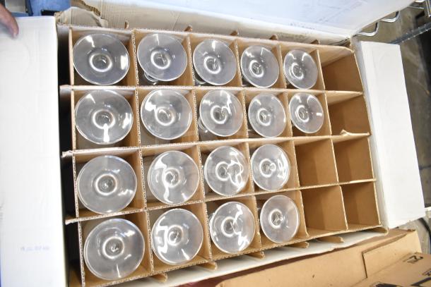Box of 24 glass cups, some stacked in two layers, shown in two rows.