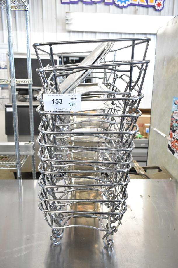 Stack of 15 chafing dish frames, metal construction, auction lot 153, QTY V15, labeled for PCI Auctions.