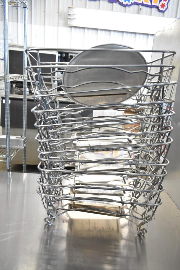 Stack of 15 metal chafing dish frames on a stainless steel surface, in good condition.