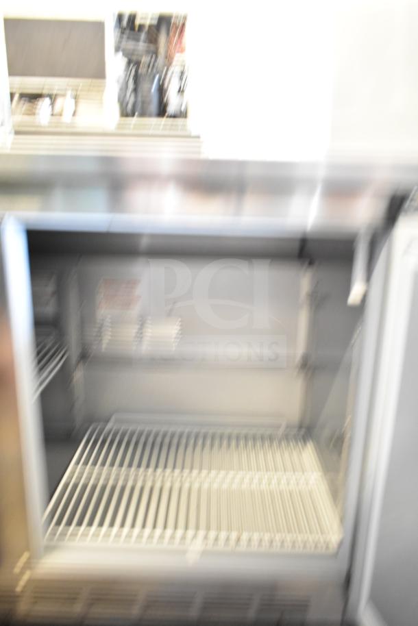 Beverage Air WTR48AHC commercial undercounter cooler, 2-door, 115 volts, 1 phase, interior rack shown, unclear markings.