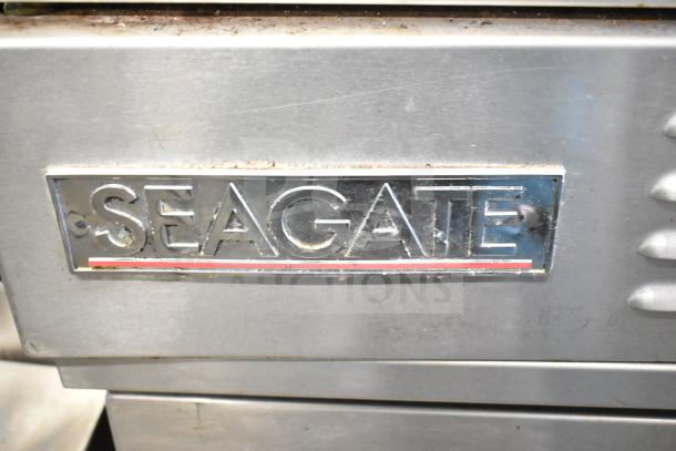 Seagate commercial convection ovens with view-through doors, thermostatic controls, and commercial casters. Logo visible.