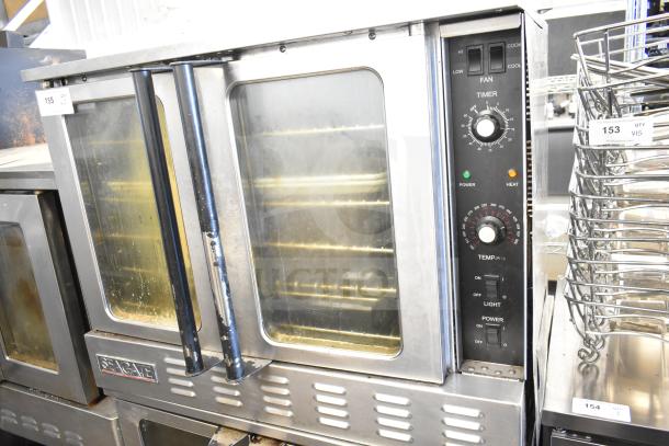 2 Seagate convection ovens with view-through doors, thermostatic controls, and commercial casters; good condition.